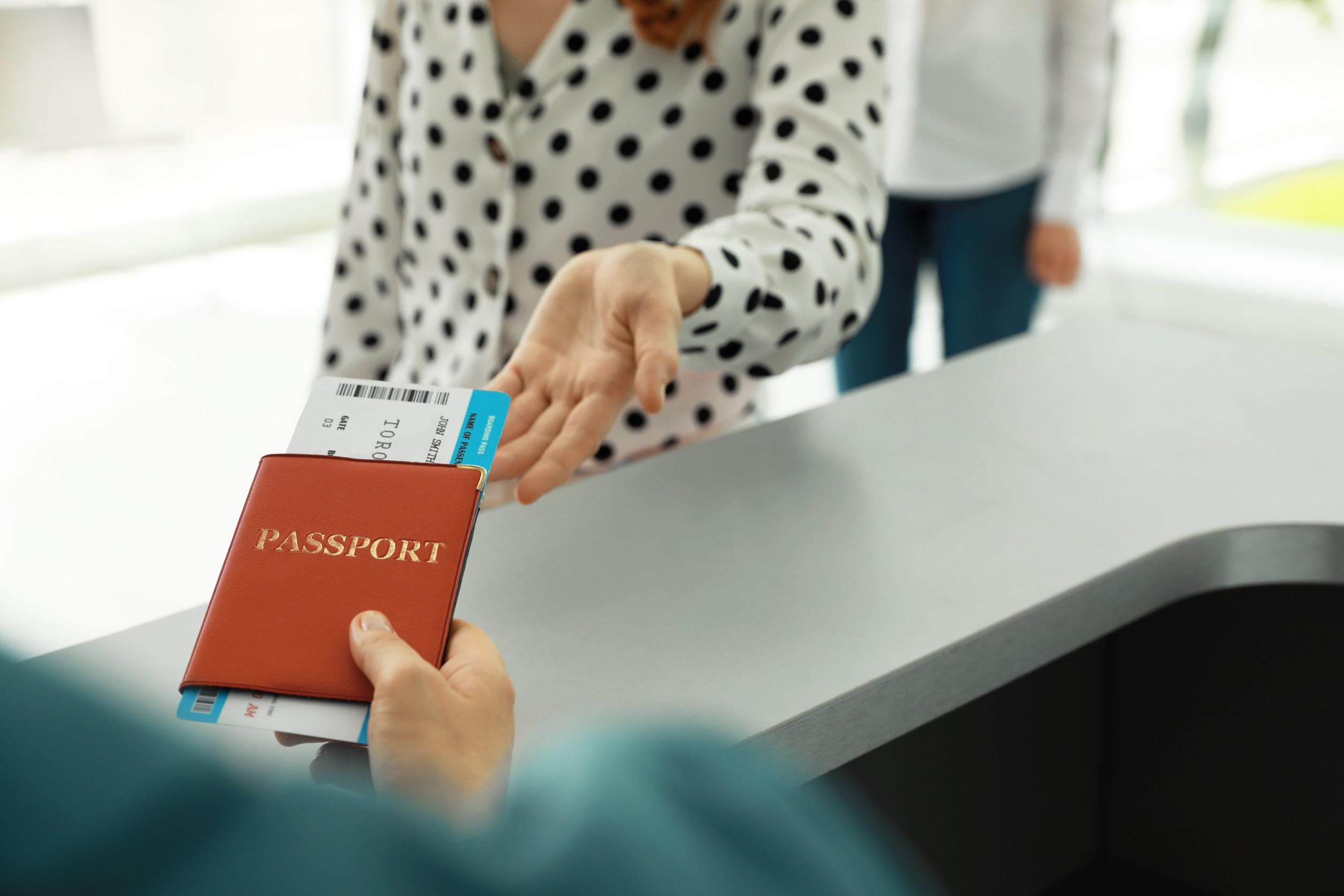 Agent Giving Passport And Ticket