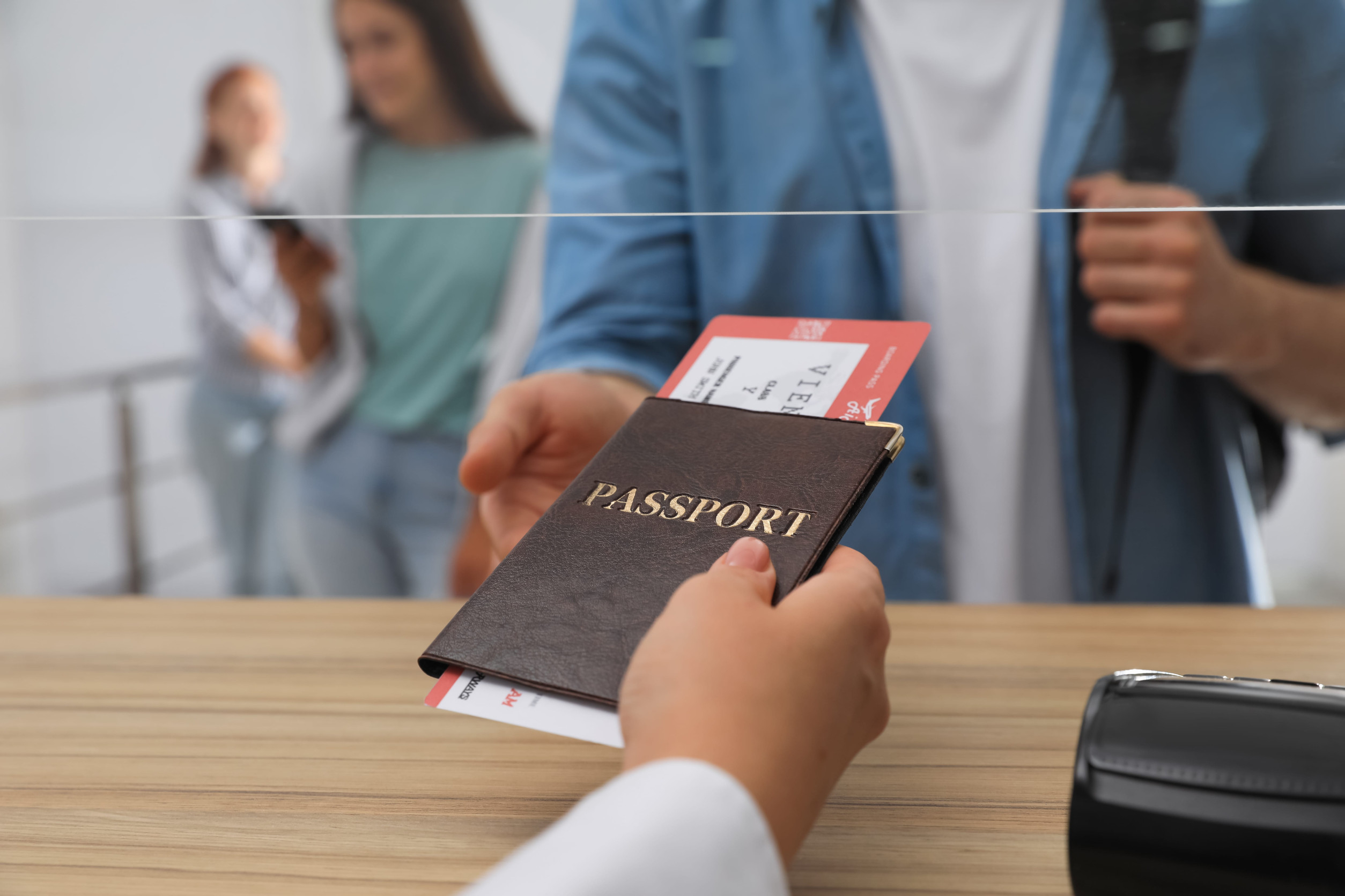 Agent Giving Passport With Ticket To Client