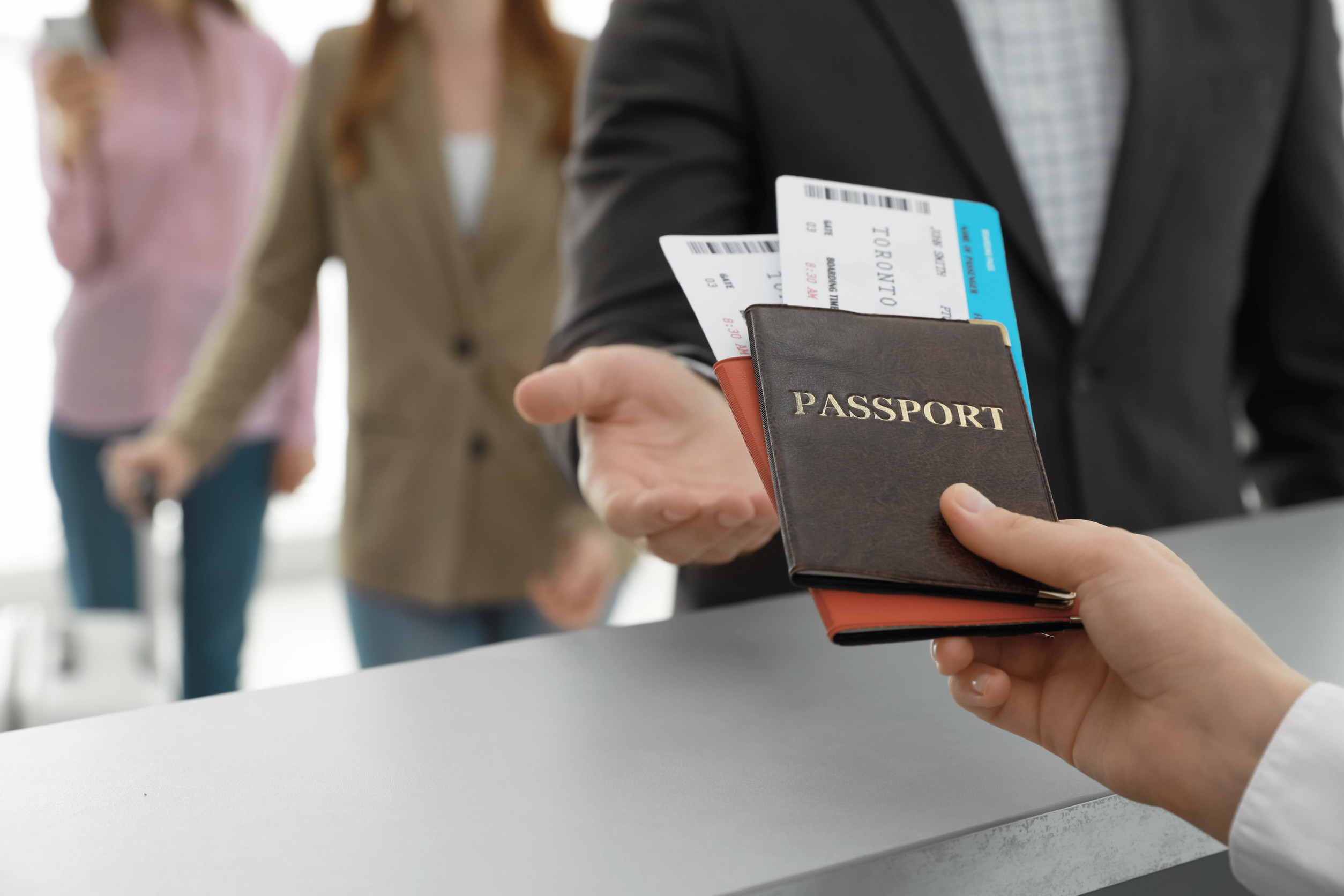 Agent Giving Passports And Tickets To Man