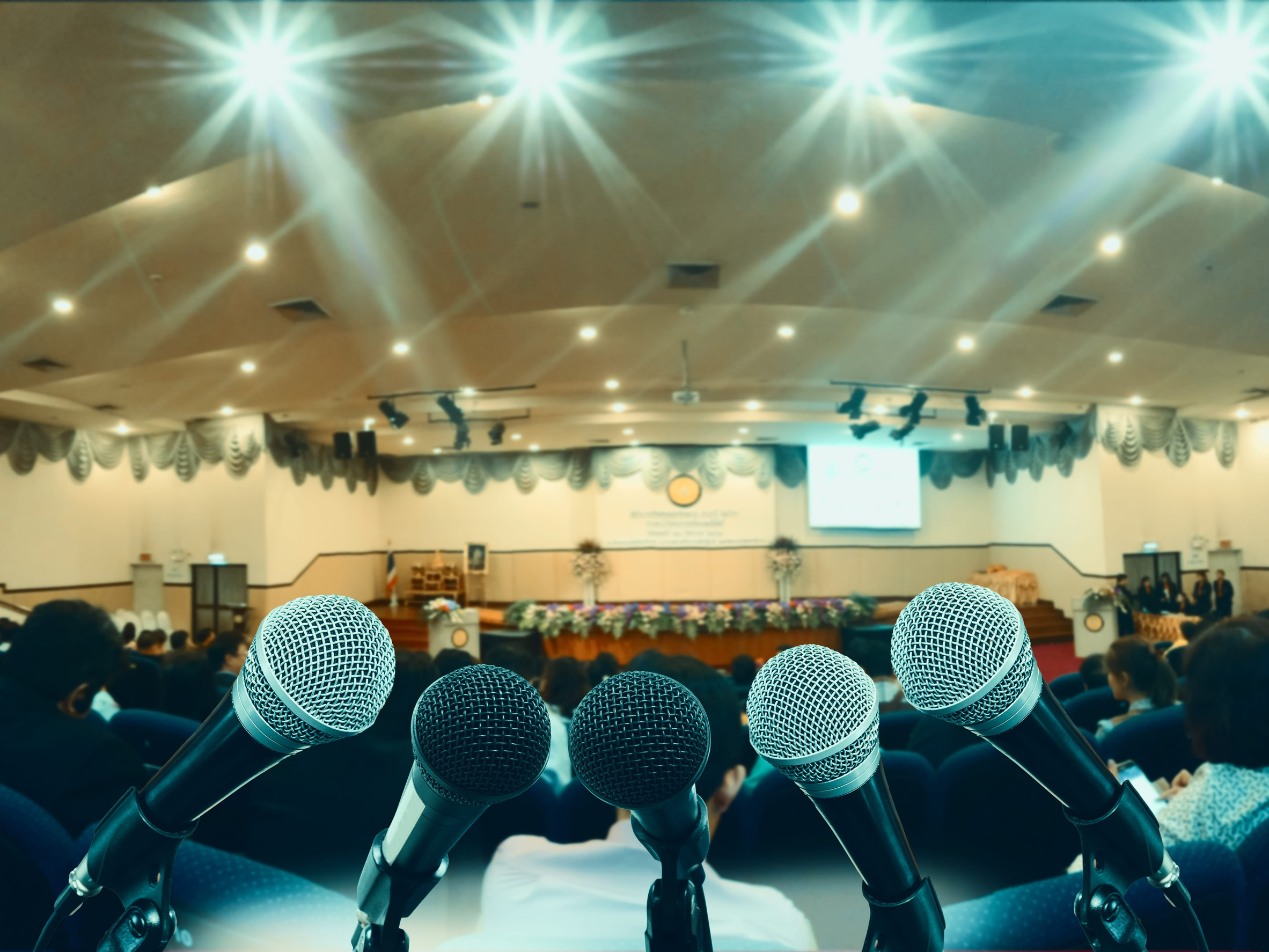 Conference hall with microphones and audience seating