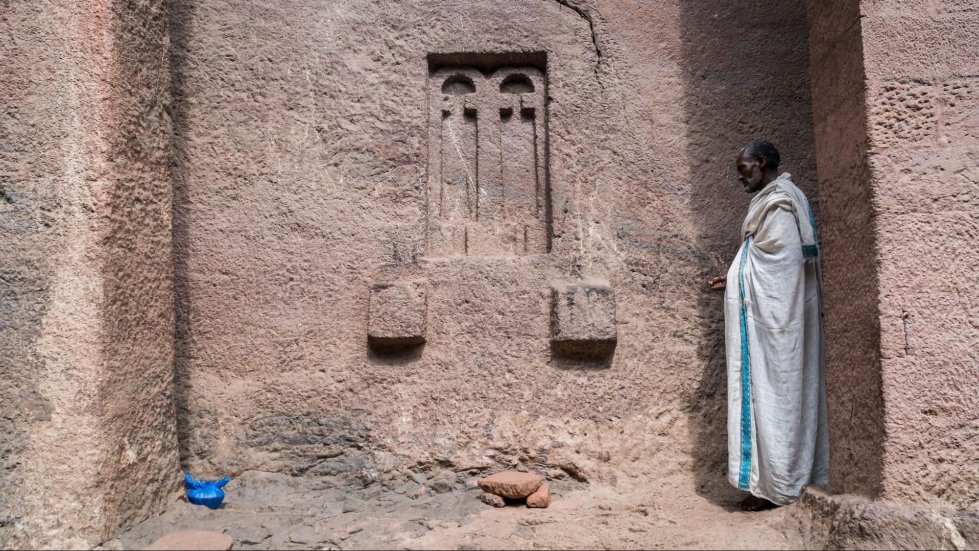 Pilgrim at one of the old rock churches from Lalibela