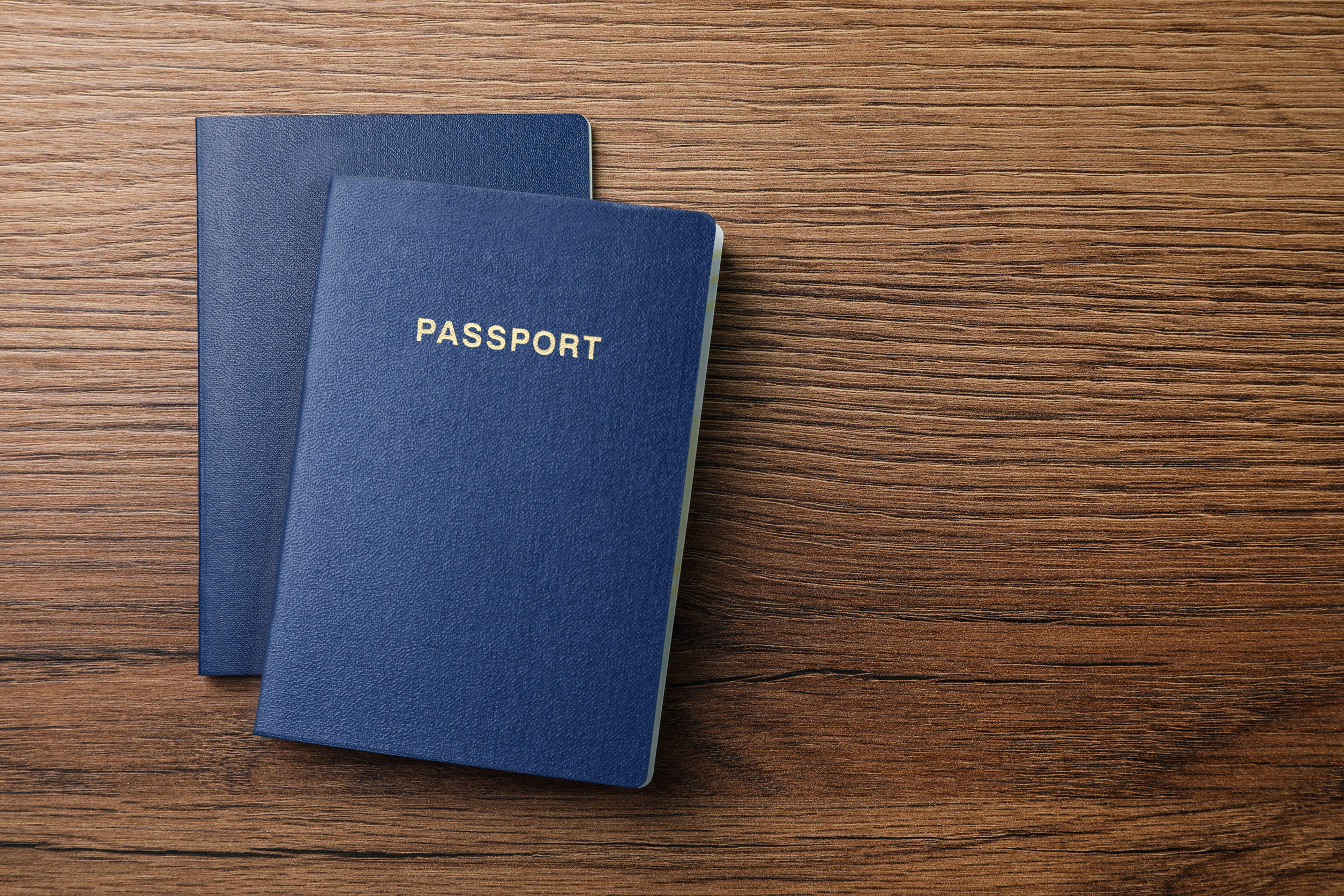Passports On A Wooden Background