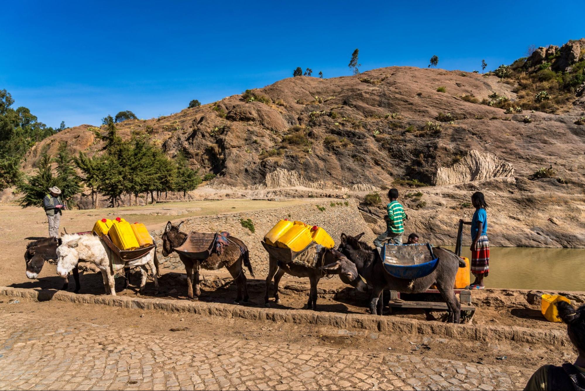 people at the ruins of the baths of the Queen of Saba, Africa