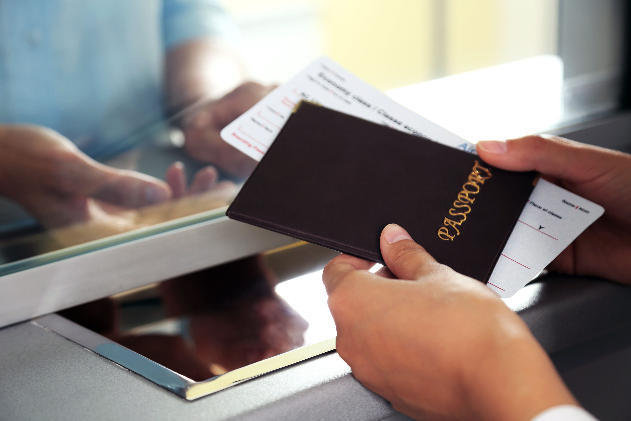 Woman Buying Tickets With Passport
